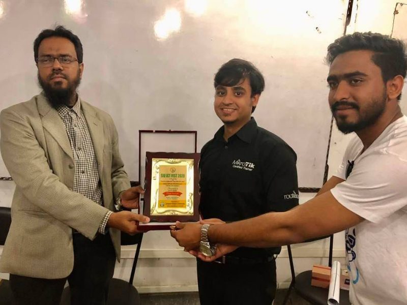 Receiving crest from Sylhet International University
